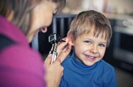 Young boy haring an ear check